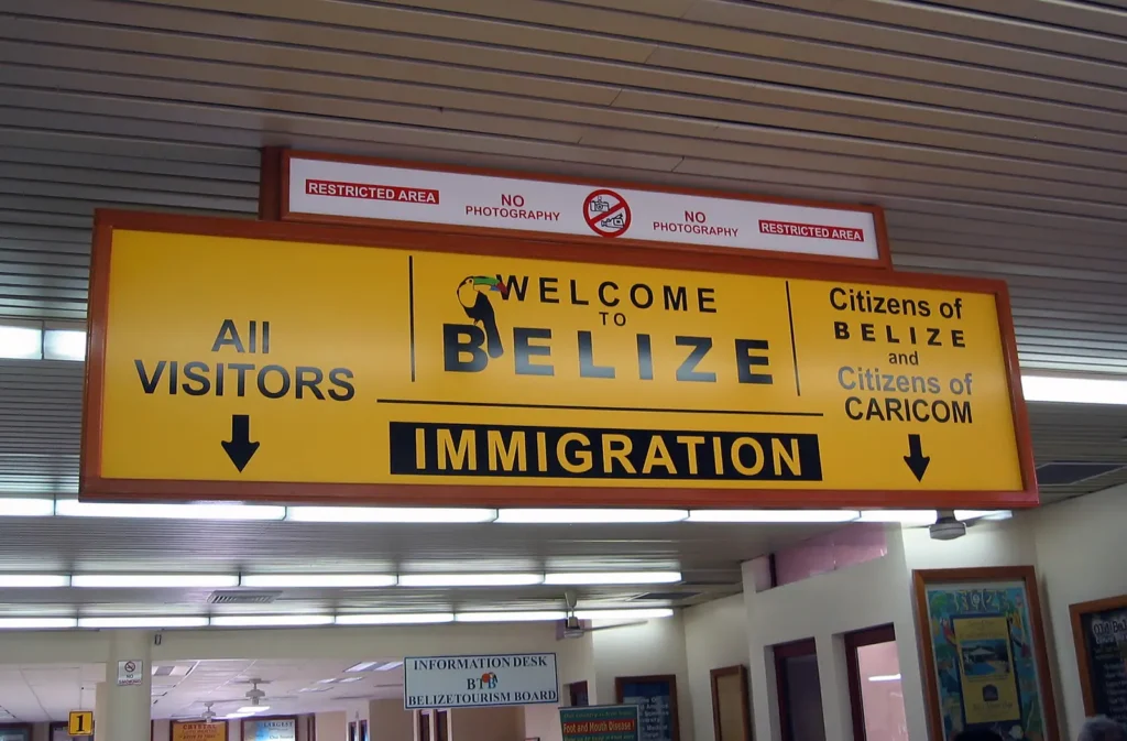 why visit belize english first language airport